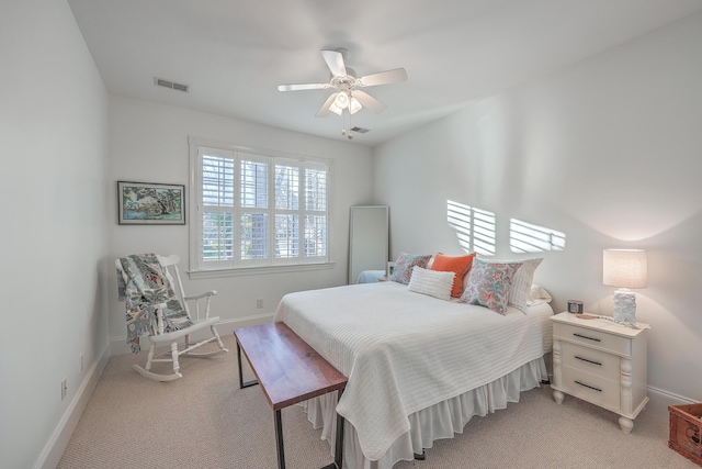 bedroom with light carpet and ceiling fan