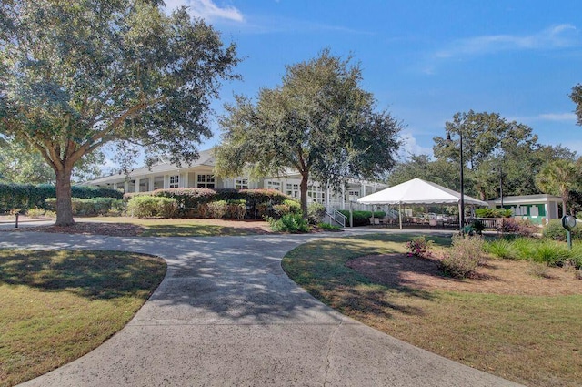 view of home's community with a yard