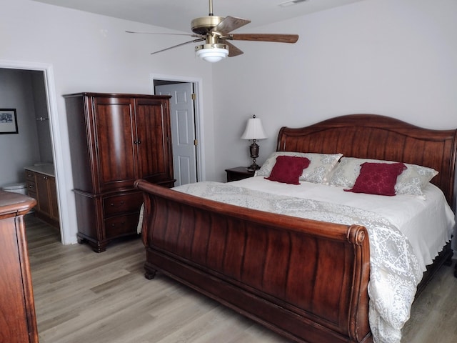 bedroom with visible vents, light wood-style floors, ensuite bath, and ceiling fan