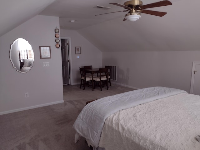 bedroom with a ceiling fan, baseboards, visible vents, vaulted ceiling, and carpet flooring