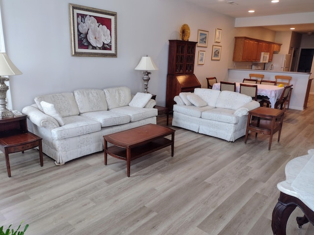 living room featuring recessed lighting and light wood-type flooring