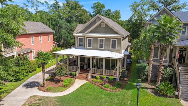 view of front of home featuring covered porch and a front yard