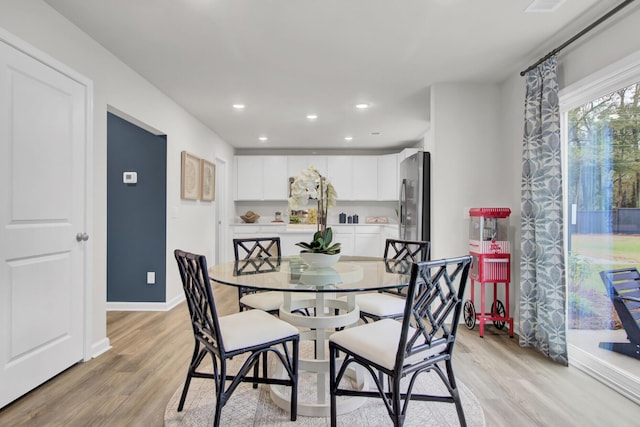 dining room with light hardwood / wood-style floors