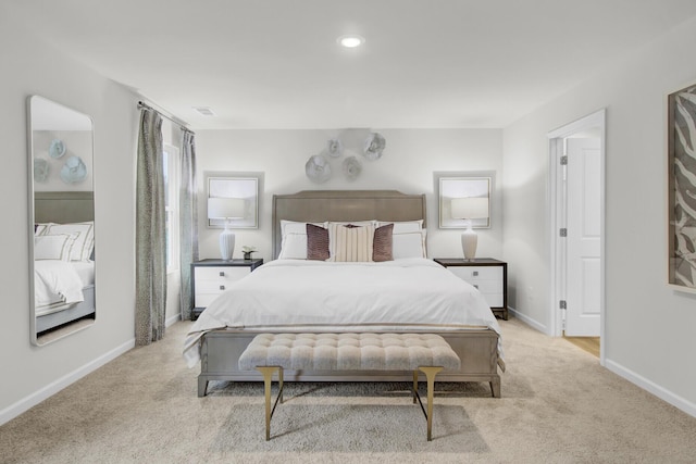 bedroom featuring light carpet