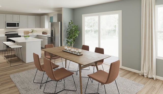 dining area with light wood-type flooring