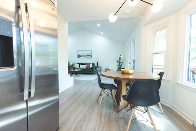 dining area featuring light wood finished floors, plenty of natural light, lofted ceiling, baseboards, and recessed lighting