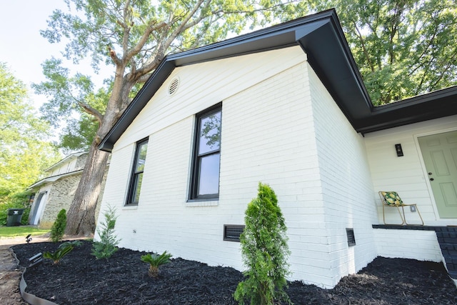 view of home's exterior with brick siding