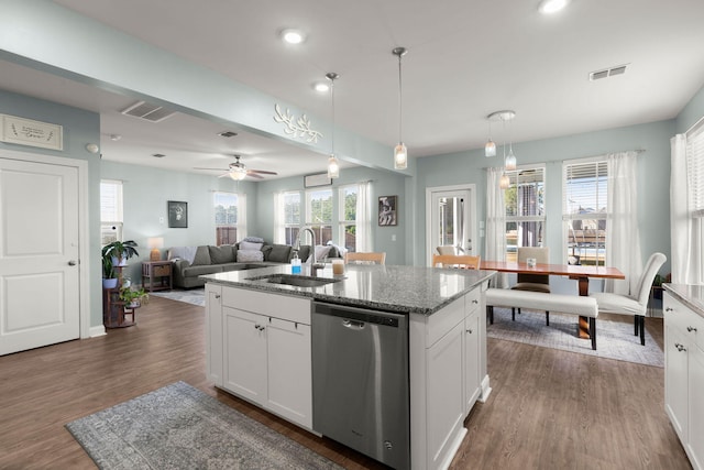 kitchen featuring a kitchen island with sink, dishwasher, white cabinetry, and dark hardwood / wood-style floors