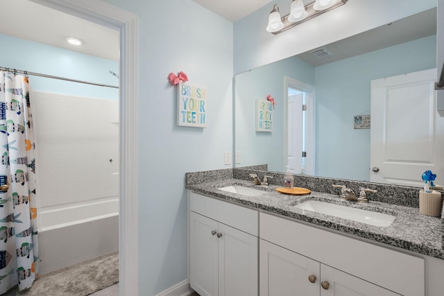 bathroom featuring vanity and shower / tub combo with curtain