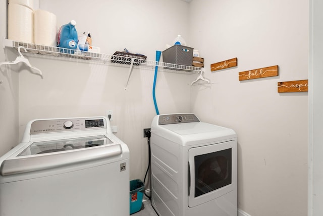 laundry room with washing machine and dryer