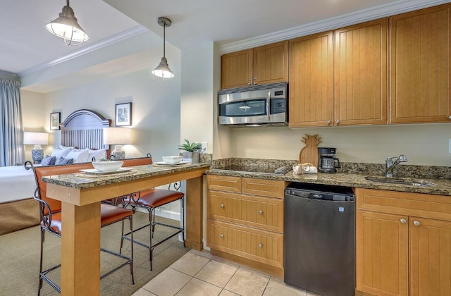 5802 Palmetto Dr Unit B 314, Isle Of Palms, SC 29451 - kitchen with stainless steel microwave, a sink, ornamental molding, open floor plan, and black electric cooktop