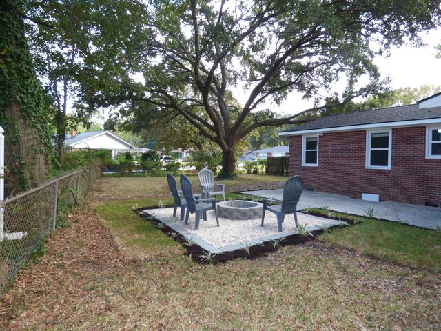 view of yard with a patio area and an outdoor fire pit