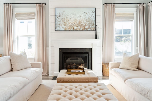 living room with plenty of natural light and hardwood / wood-style floors