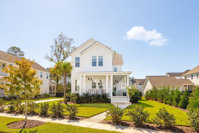 view of front of house with a front lawn and covered porch