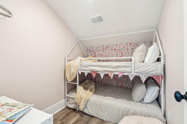 bedroom with hardwood / wood-style floors