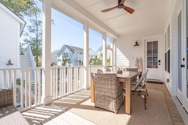 sunroom / solarium with ceiling fan