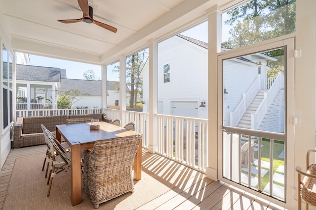 sunroom / solarium featuring a wealth of natural light and ceiling fan