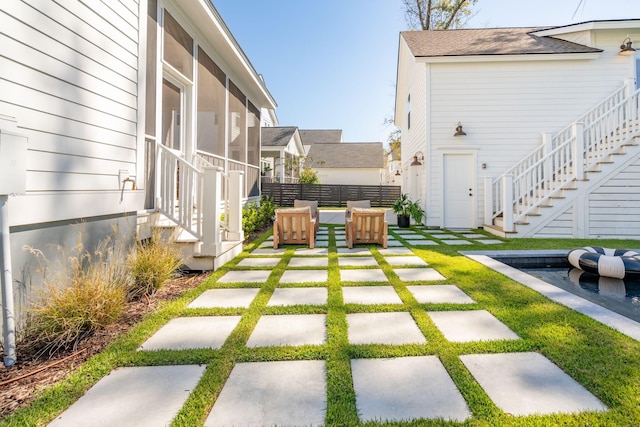 view of yard with a patio and a sunroom