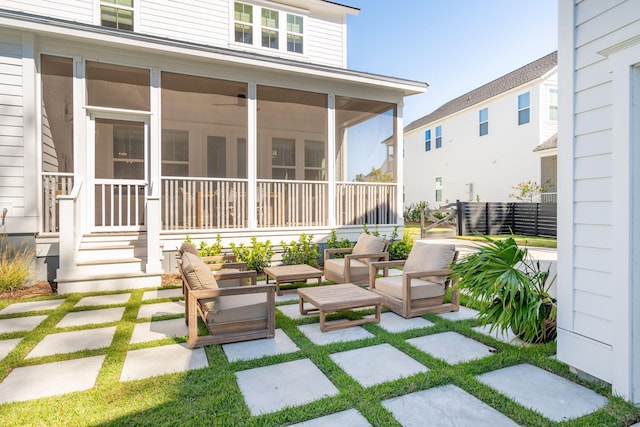 view of patio featuring a sunroom