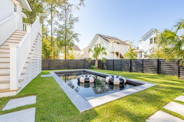 view of yard featuring a fenced in pool