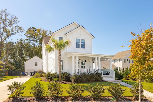 view of front facade with covered porch and a front lawn