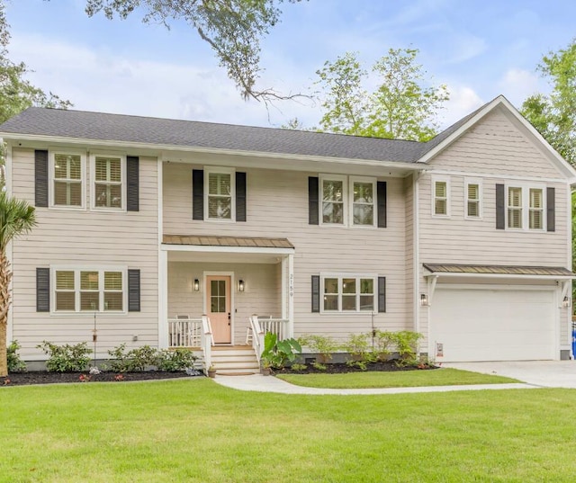 view of front of house featuring a porch, a garage, and a front yard