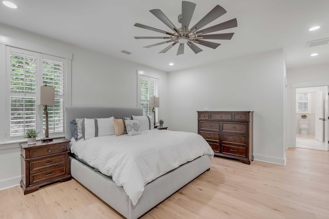 bedroom featuring ceiling fan, connected bathroom, and light hardwood / wood-style floors