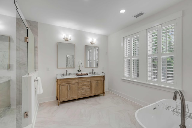 bathroom featuring vanity and shower with separate bathtub