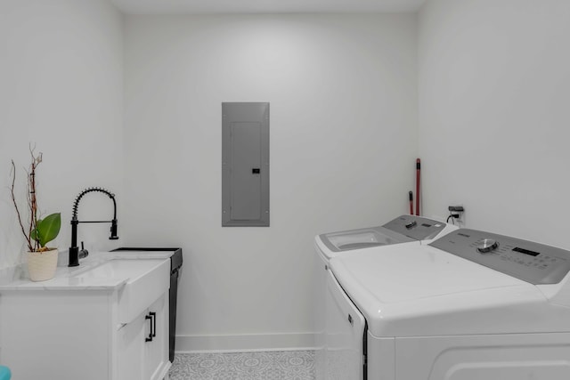 washroom featuring cabinets, separate washer and dryer, and electric panel