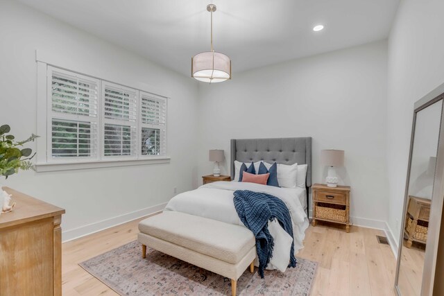 bedroom with light wood-type flooring