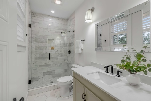 bathroom with walk in shower, vanity, and toilet