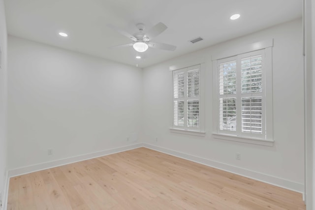 spare room featuring ceiling fan and light hardwood / wood-style floors