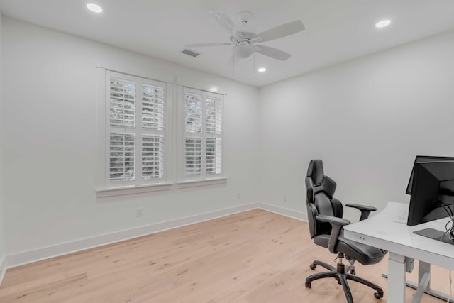 office area featuring light hardwood / wood-style flooring and ceiling fan