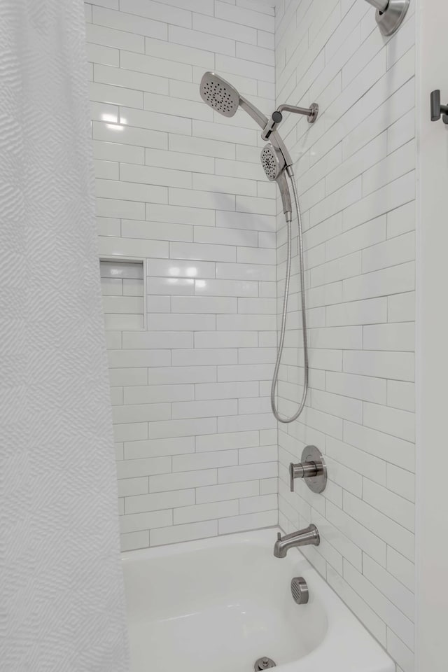 bathroom with shower / bath combo