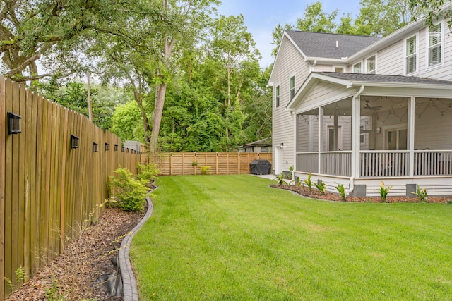 view of yard with a sunroom