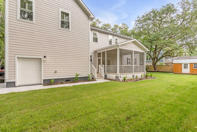 back of house featuring a sunroom and a yard