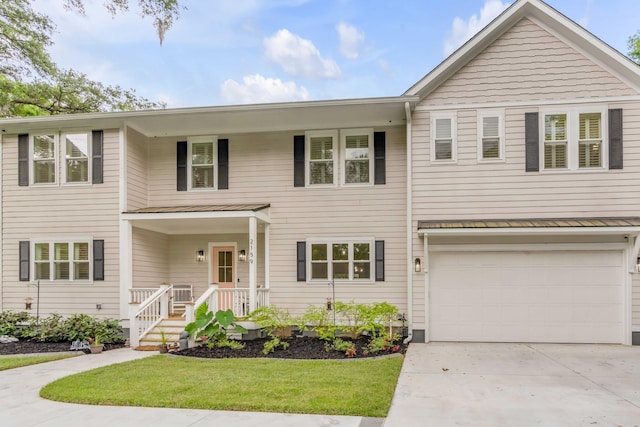 view of front of house with a garage and a front lawn