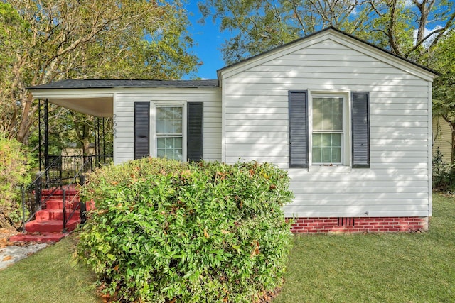 view of property exterior featuring a yard