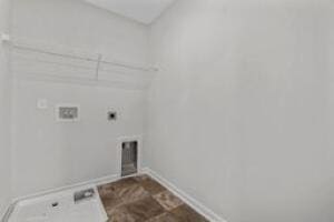 washroom featuring laundry area, hookup for an electric dryer, and baseboards