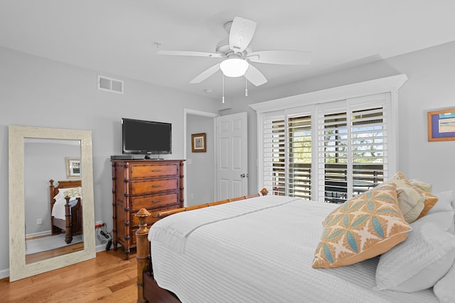 bedroom featuring ceiling fan, light wood-style flooring, visible vents, baseboards, and access to outside