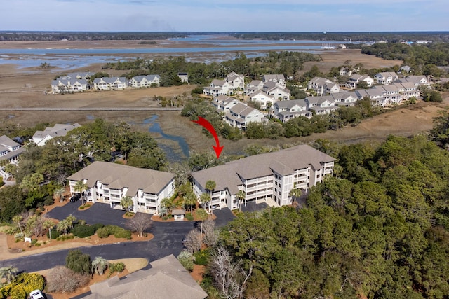 bird's eye view featuring a residential view and a water view