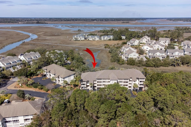 bird's eye view featuring a water view and a residential view