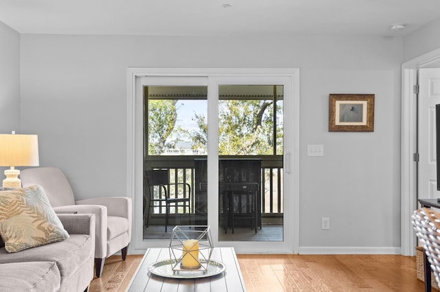 interior space with light wood-style flooring and baseboards