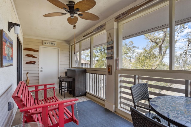 sunroom / solarium with ceiling fan