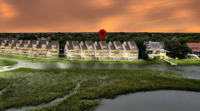 aerial view at dusk with a water view