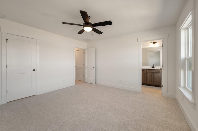414 Katies Scenic Ct, Charleston, SC 29492 - unfurnished bedroom featuring baseboards, a sink, light colored carpet, and connected bathroom