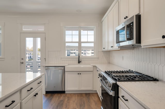414 Katies Scenic Ct, Charleston, SC 29492 - kitchen featuring a sink, white cabinetry, backsplash, appliances with stainless steel finishes, and light stone countertops