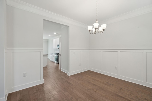 unfurnished dining area with crown molding, dark hardwood / wood-style floors, and a chandelier