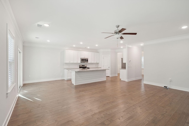 unfurnished living room with crown molding, ceiling fan, and light wood-type flooring