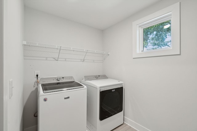 washroom featuring washing machine and clothes dryer